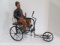 Large Charlie Chaplin Figure on Movable Metal Tricycle Bike