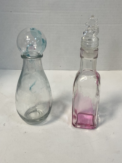 Tinted Glass Bulb Top Decanter and Knights Head Top Decanter 7 1/4'' Tall and 8'' Tall.