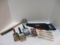 Seven New Paint Brushes, Wire Rush, Sanding Sponge, Tape, Pro Series Hand Saw.