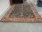 Maroon and Burgundy Floral Rug with Fringe.
