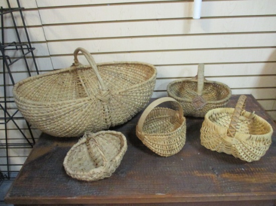 One X-Large and Four Smaller Woven Buttocks Baskets.