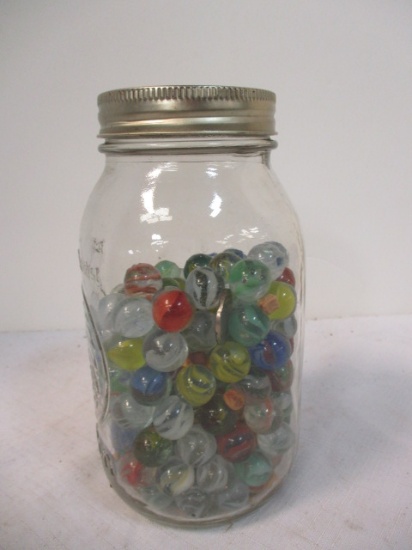 Ball Mason Jar Over Half Full of Marbles.