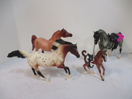 Three Arabian Plastic Horses and one Colt, Two Saddles. All But Grey Horse Marked Breyer.