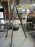 Cast Iron Pot with Lid on Tripod for Cooking.