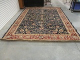 Maroon and Burgundy Floral Rug with Fringe.