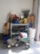 Contents of Garage Corner: 3 Tier Shelf Unit, Yard Tools, Yard Chemicals, Tarps,
