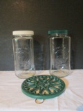 Two Golden Harvest Glass Cannisters and Enamel Coated Cast Metal Trivet