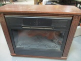 Heat Surge Electric Fireplace with Woodgrain Surround on Casters - Model #M17