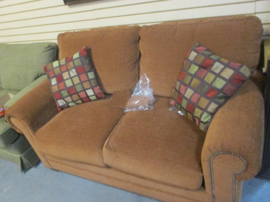 Bassett Rust Colored Loveseat with Nail Head Trim and Pair of of Pillows. Very Good Condition.
