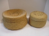 Two Round Woven Baskets with Lids.