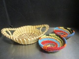 Two Colorful Small Round Braided Baskets and a Gullah Sweetbriar Basket.