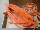 Extra Long Extension Cord on Holder and Twelve Foot Extension Cord.