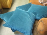 Four Velour Teal Decorative Pillows.