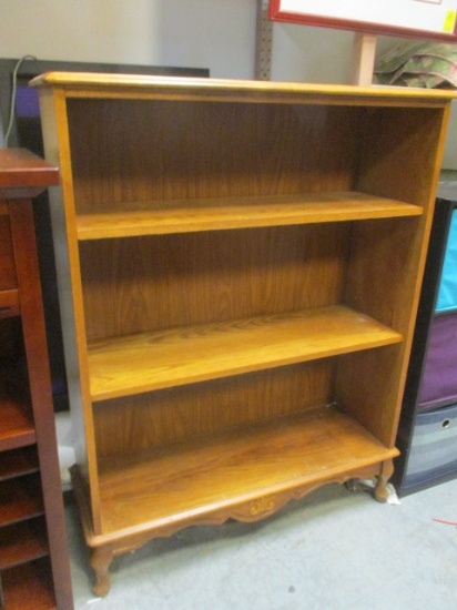 Three Shelf Oak Bookcase with Adjustable Shelves and Decorative Bottom and Legs.
