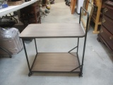 Rolling  Table with Two Shelves.