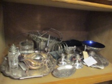 Grouping of Silverplated Serving Pieces-Candle Holders, Trivets, Wine Bottle Basket,