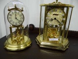 2 Kundo Anniversary Clocks: W. Germany With Porcelain Face & Germany With Brass Face. Working.