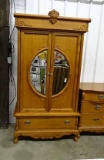 Contemporary Oak Double Door Armoire With Half Moon Beveled Mirrors In Each Door. Applied Carvings O
