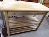 Butcher Block Kitchen Island. Chrome Towel Bar On Drawer Front, Slatted Shelf In Base. Top Has Rolle
