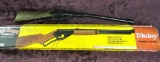 2 Daisy BB Guns: Red Ryder Carbine In Box Has Wood Stock. Smaller Has Plastic Stock