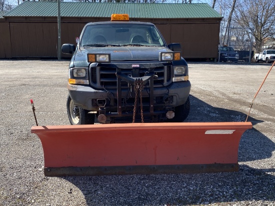 2003 Ford F250 pickup with plow