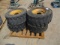 (4) Skid Steer 12-16.5 Tires & 8-Lug Rims