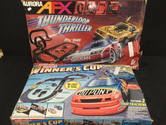 2 slot car sets look complete by Life-like racing and Tomy 1985/1995