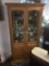 Gorgeous beveled glass curio cabinet with lighted top and mirror back