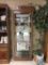 Modern curio cabinet with lifted top and glass doors/ shelves
