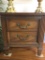 Vintage 40's influenced 2 drawer nightstand with brass pulls and ornate design