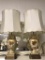 Pair of vintage french inspired white and gold lamps w/ metal base and deco gilded design