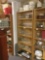 Bookcase full of glass stemware sets and kitchen items