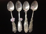 Set of four figural antique sterling silver spoons