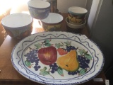 Collection of vintage colorful ceramic bowls and large fruit platter