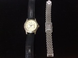 2 Stauer watches, man and womans, woman's watch has sterling silver ingot for face