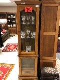 Skinny oak and glass curio cabinet with lighted top