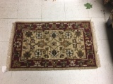 Antique hand knotted wool rug with angular floral pattern - $129 tag