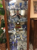 Contents of curio cabinet - incl. antique Quimper plates, white and blue china pieces, Japanese