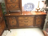 Vintage 40's influenced 9 drawer dresser with brass pulls and ornate design