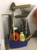 Tub full of yard tools and more incl. electric chainsaw and weedeater