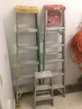 Set of two aluminum and fiberglass 6 ft ladders w/ additional smaller ladder / step stool