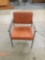 Vintage mid-century modern orange upholstered metal and wood chair by Art Metal Inc.