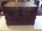 Antique wood steamer trunk w/ leather & metal hardware - nicely preserved inside wallpaper