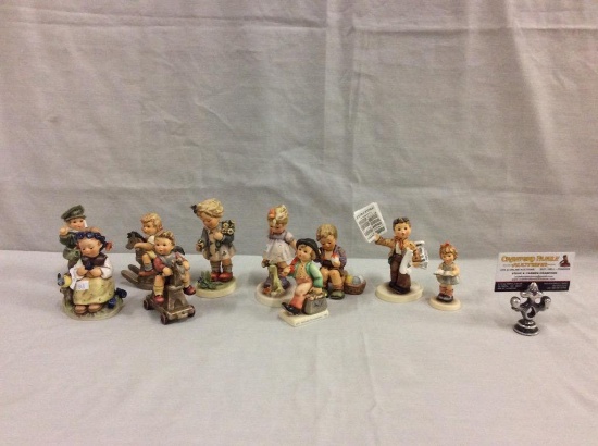 Collection of 10 TMK8 Hummel figurines includes "Extra, Extra" see pics