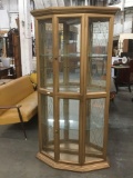 Vintage gold colored 1960's lighted curio cabinet.