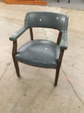 Vintage blue upholstered wooden rolling chair