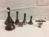 set of antique school, dinner and desk bells