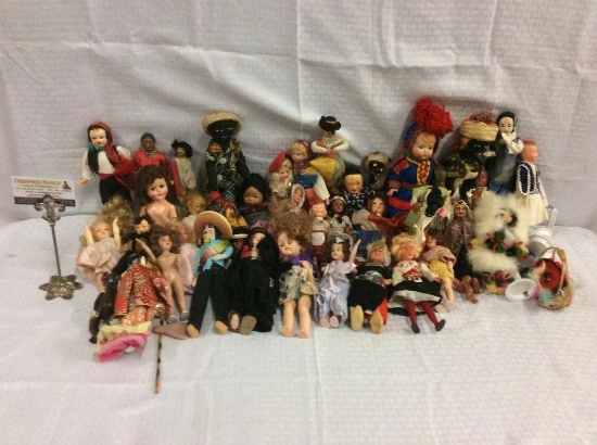 Large collection of vintage plastic and some cloth dolls from various countries and in various style