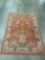 Gorgeous orange and blue patterned rug with tree/flower and bird scene motif