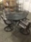 Metal outdoor patio table w/ four cushioned swivel chairs